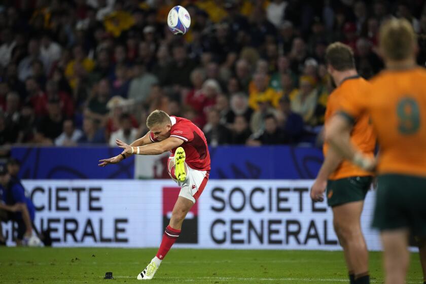 Wales' Gareth Anscombe kicks a penalty during the Rugby World Cup Pool C match between Wales and Australia at the OL Stadium in Lyon, France, Sunday, Sept. 24, 2023. (AP Photo/Christophe Ena)