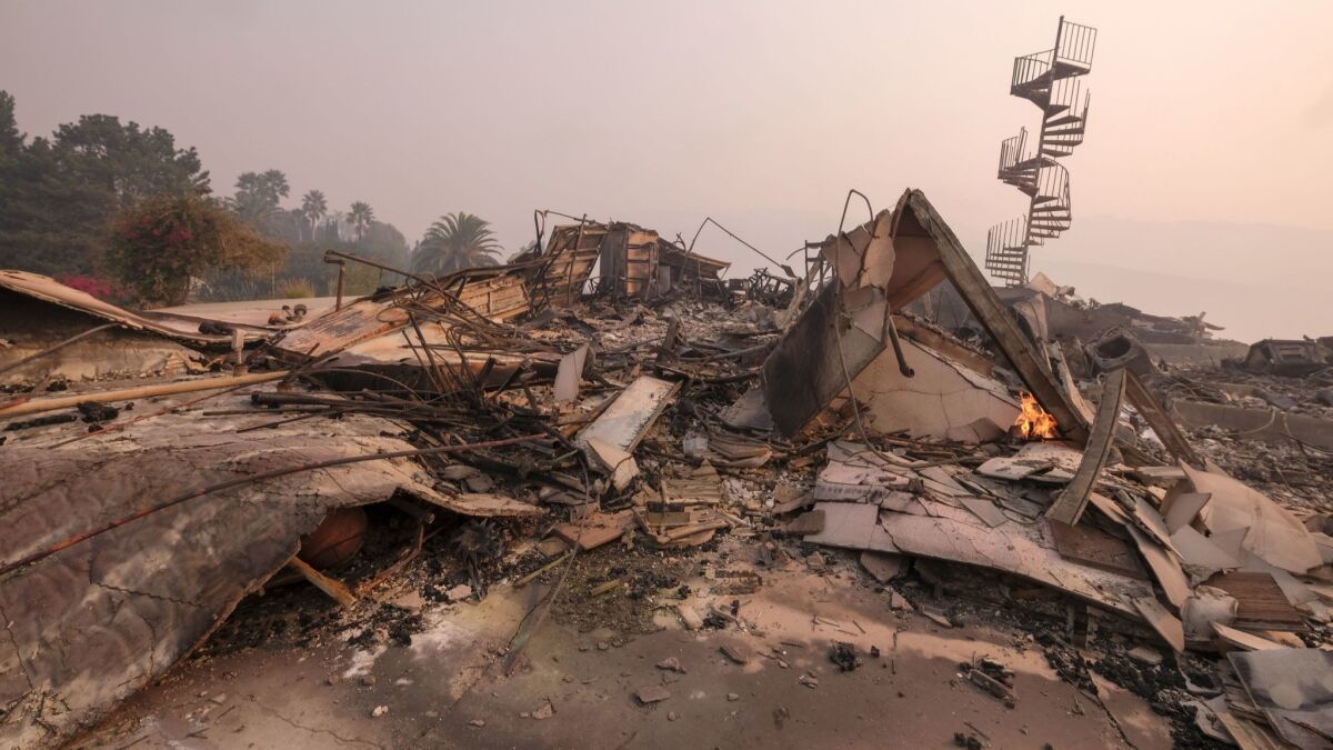 The charred remains of a burned-out home are seen in Malibu, Calif. on Nov. 10.