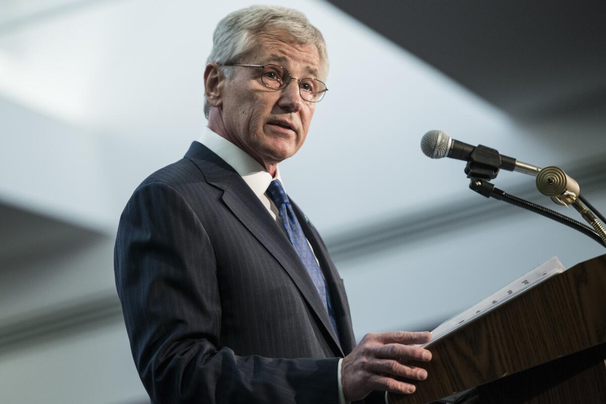 Defense Secretary Chuck Hagel speaks during a retirement ceremony for Army Gen. Keith B. Alexander at the National Security Agency.