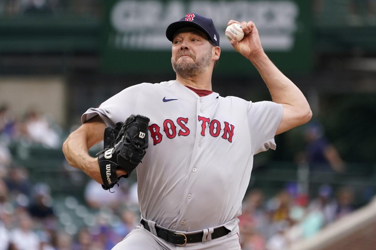 Boston Red Sox starting pitcher Rich Hill throws against the Chicago Cubs during the first inning of a baseball game in Chicago, Friday, July 1, 2022. (AP Photo/Nam Y. Huh)