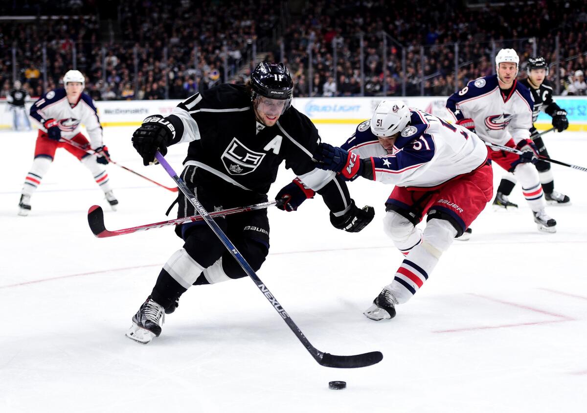 Kings center Anze Kopitar skates around Columbus' Fedor Tyutin in the second period Thursday night.