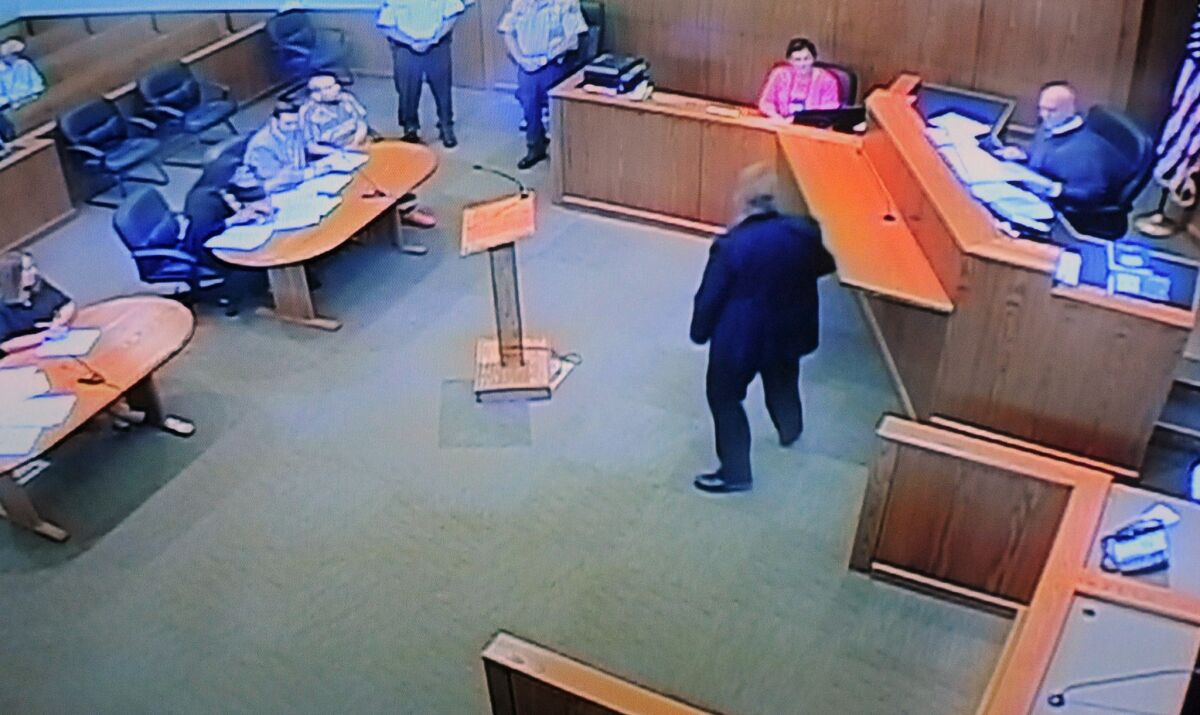In this photo from a video monitor at the Union County Courthouse in Jonesboro, Ill., Anthony Garcia, in striped shirt, a doctor from Indiana who is a suspect in four killings in Nebraska, sits with attorneys during his extradition hearing before Judge Mark Boie, right, on Wednesday. Garcia waived extradition and will return to Omaha to face murder charges. Garcia, who lives in Terre Haute, Ind., was arrested Monday in Union County in southern Illinois.