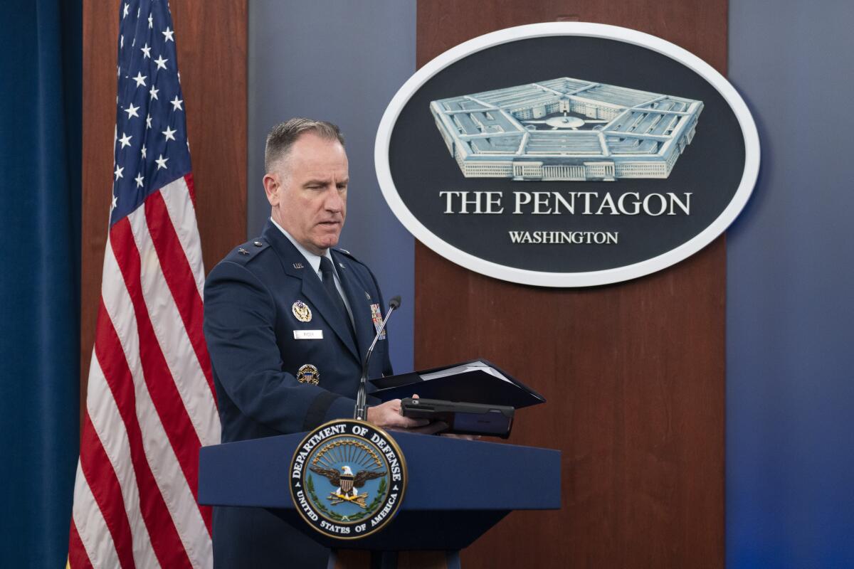 Pentagon spokesman U.S. Air Force Brig. Gen. Pat Ryder speaks at a lectern with a Pentagon logo behind him