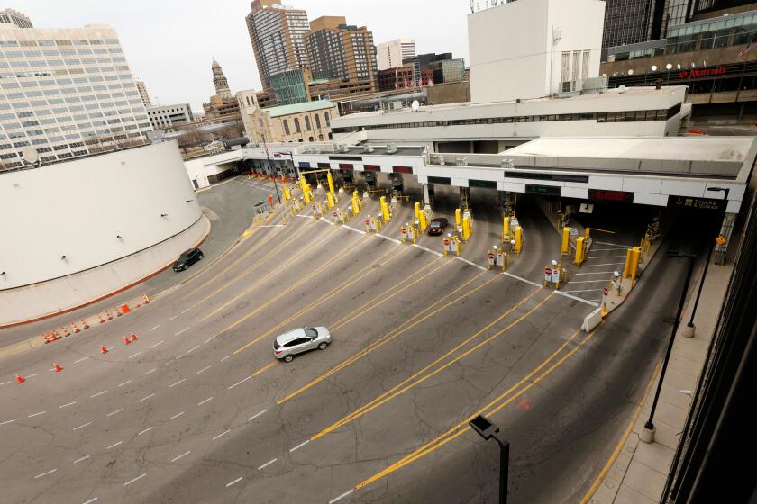 A light flow of vehicles from Windsor, Canada, that traveled through the Detroit Windsor Tunnel enter the customs area in Detroit, Michigan on March 18, 2020. - US and Canada have mutually agreed on March 18, 2020 to temporarily restrict " non essential traffic" accross Canada-US border due to the coronavirus pandemic. (Photo by JEFF KOWALSKY / AFP) (Photo by JEFF KOWALSKY/AFP via Getty Images)