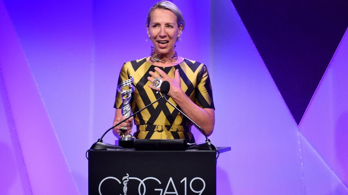 Costume designer Michele Clapton accepts the Outstanding Period Television Series award for 'The Crown' at the 19th Costume Designers Guild Awards.