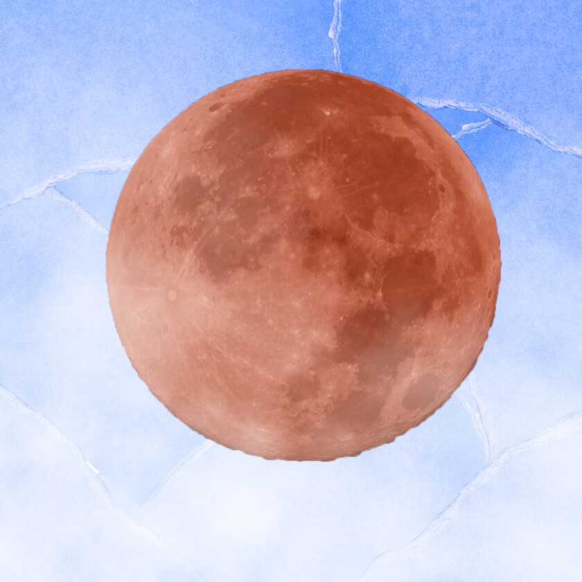 Closeup of a reddish moon on a blue background.