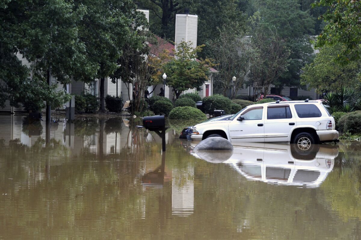 A flooded neighborhood is shown in Pelham, Ala., Thursday, Oct. 7, 2021. Parts of Alabama remain under a flash flood watch after a day of high water across the state, with as much as 6 inches of rain covering roads and trapping people. (AP Photo/Jay Reeves)