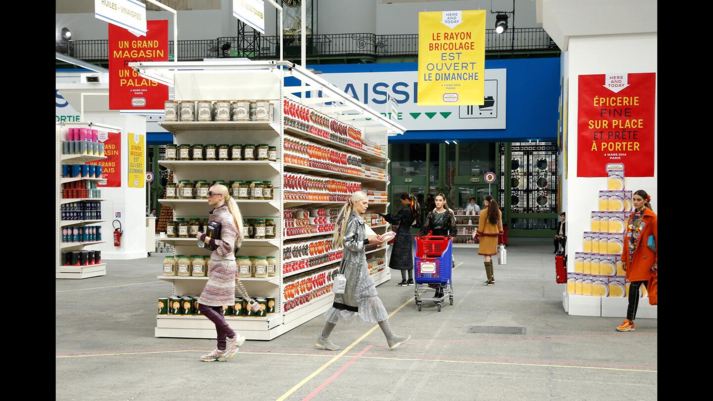 Chanel-branded groceries lined shelves at the fashion house's runway show at the Grand Palais space in Paris.