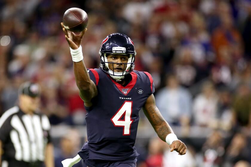 HOUSTON, TEXAS - JANUARY 04: Deshaun Watson #4 of the Houston Texans throws a touchdown pass against the Buffalo Bills during the fourth quarter of the AFC Wild Card Playoff game at NRG Stadium on January 04, 2020 in Houston, Texas. (Photo by Christian Petersen/Getty Images)