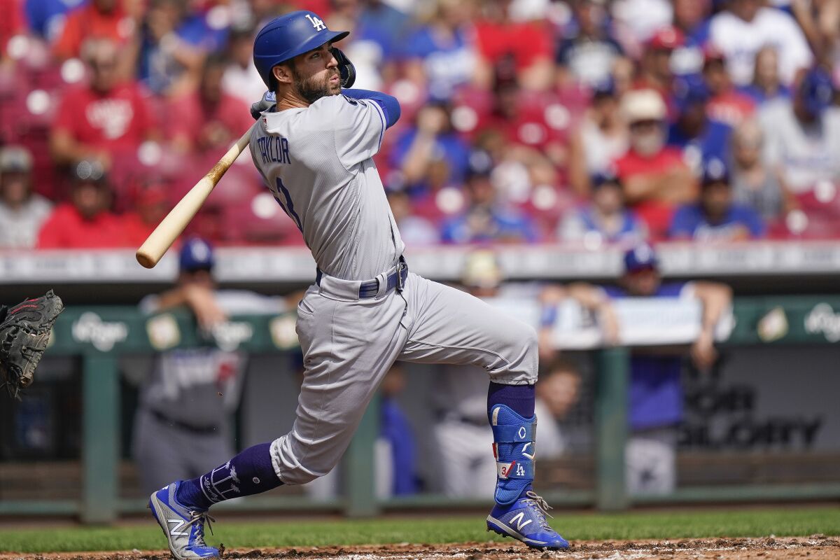 Chris Taylor singles for the Dodgers against the Cincinnati Reds on Sept. 19.