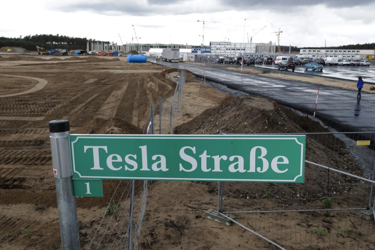 A street sign reading "Tesla Street 1" in German at the construction site of the Tesla factory near Berlin.