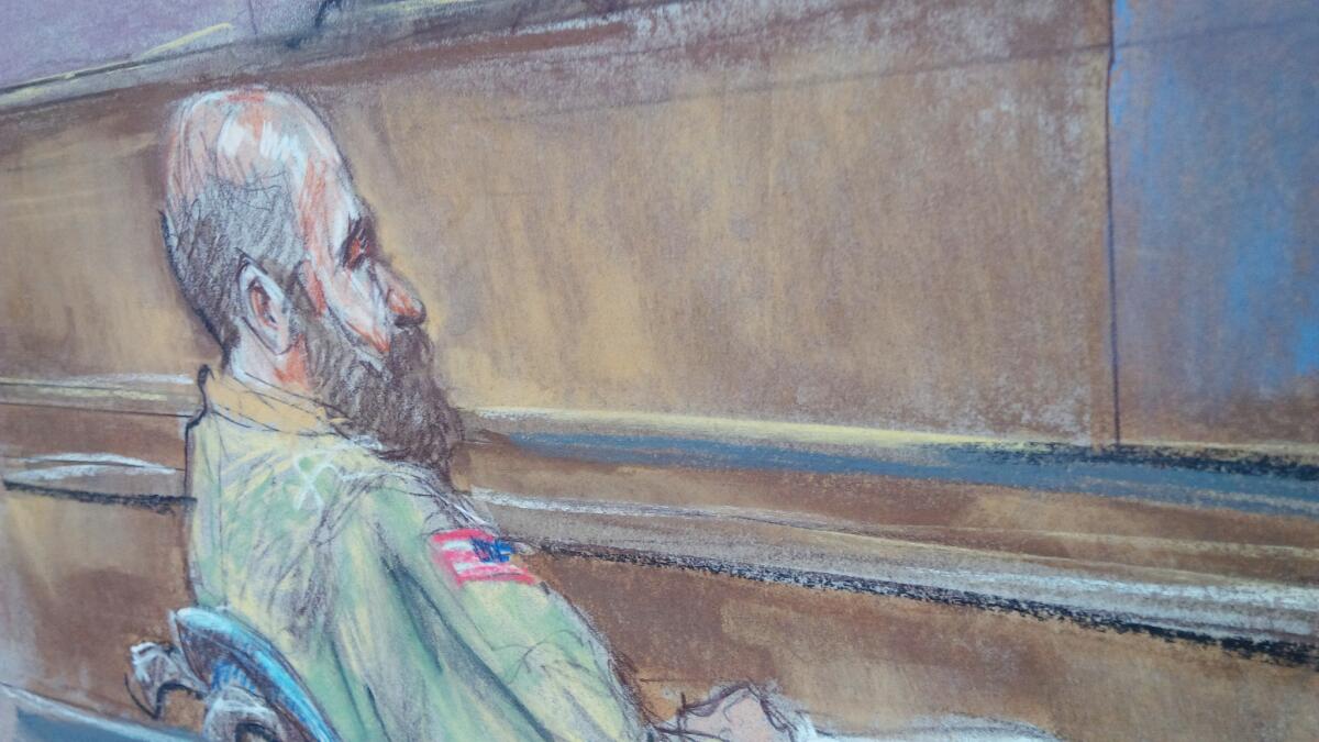 In this courtroom sketch Maj. Nidal Malik Hasan sits at his court-martial in Fort Hood, Texas on Tuesday.