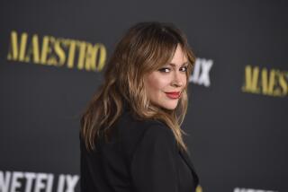 Alyssa Milano in black suit at screening of "Maestro" at the Academy Museum of Motion Pictures