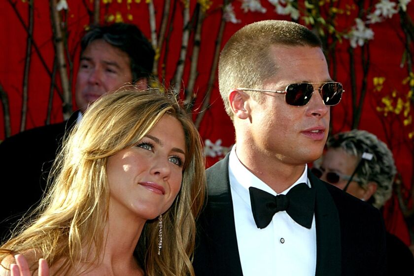 LOS ANGELES - SEPTEMBER 19: Actress Jennifer Aniston and Actor/husband Brad Pitt attend the 56th Annual Primetime Emmy Awards on September 19, 2004 at the Shrine Auditorium, in Los Angeles, California. (Photo by Kevin Winter/Getty Images)