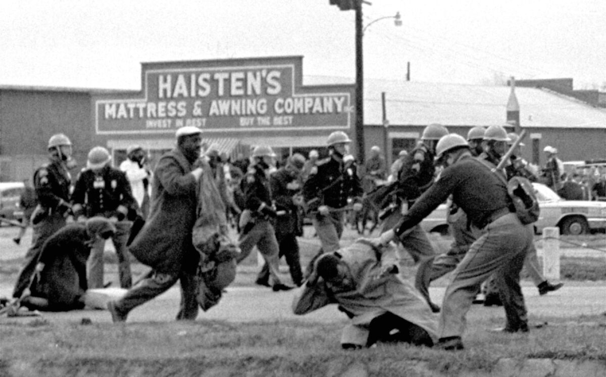 John Lewis and other demonstrators are beaten by Alabama state troopers during a 1965 civil rights march in Selma.