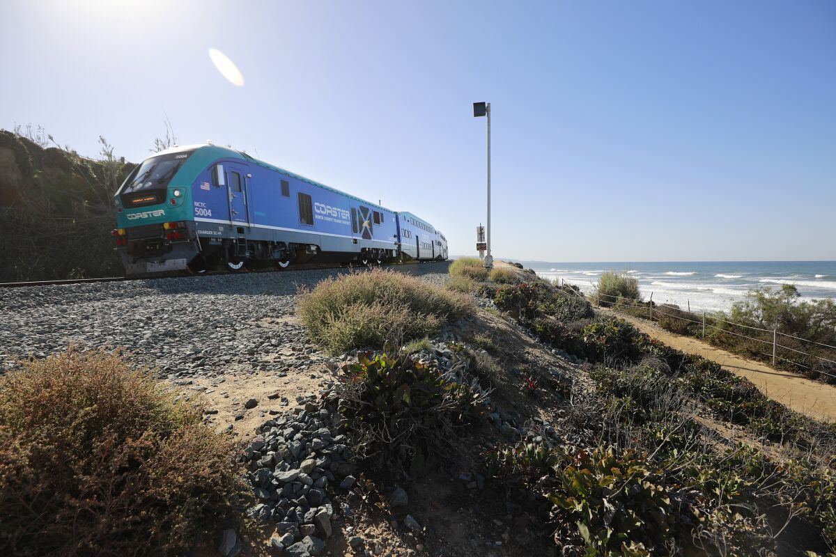 A Coaster train heads north along the bluffs in Del Mar in 2021.