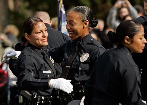 Graduating officers of the class of August 2009 greet each other after the ceremony at the Los Angeles Police Department Academy.
