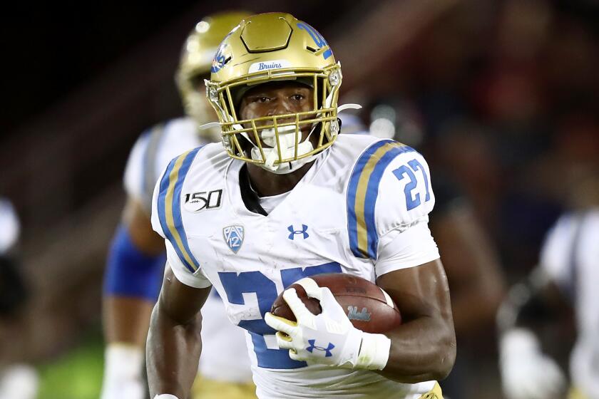 PALO ALTO, CALIFORNIA - OCTOBER 17: Joshua Kelley #27 of the UCLA Bruins runs for a large gain against the Stanford Cardinal at Stanford Stadium on October 17, 2019 in Palo Alto, California. (Photo by Ezra Shaw/Getty Images)