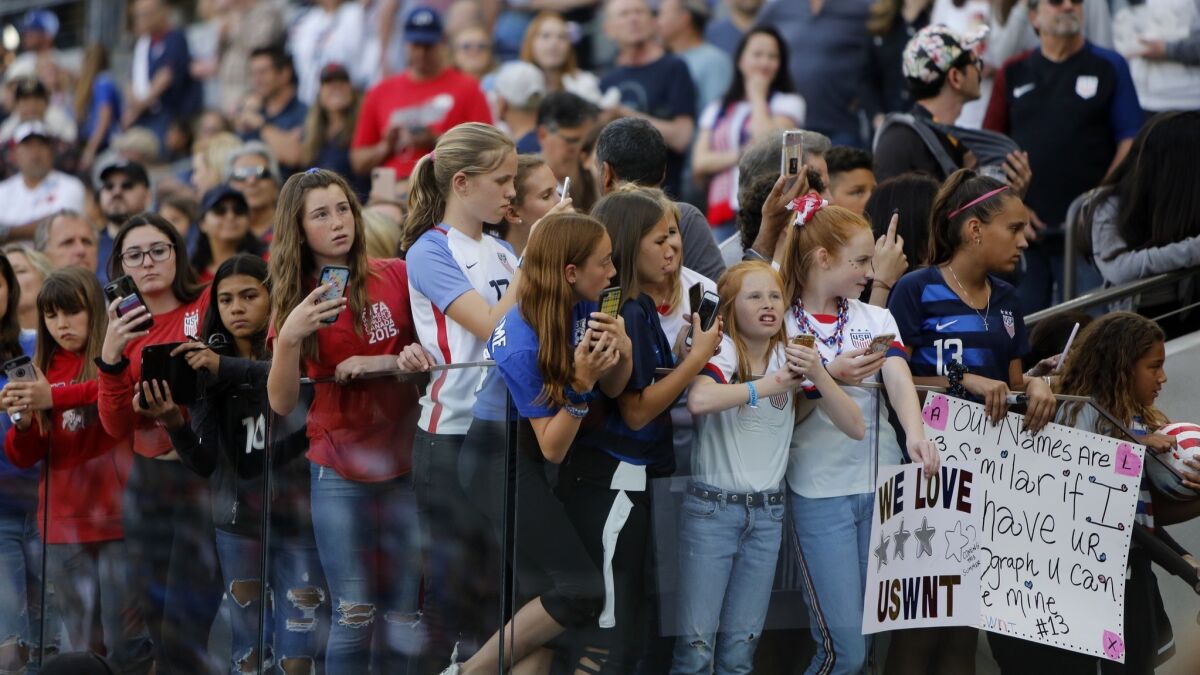 Fans wait for the U.S. women's national soccer team to come out on the field before their game against Belgium at Banc of California Stadium, on Sunday April 7, 2019, in Los Angeles, California.