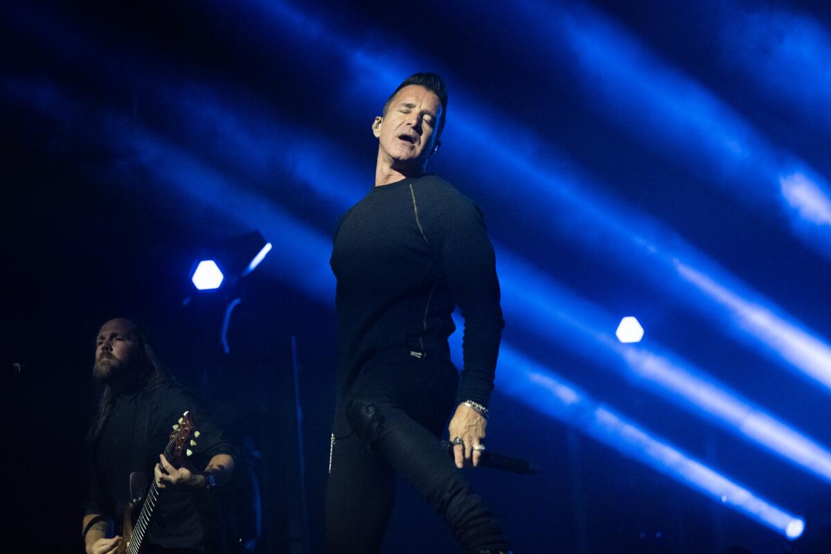 Scott Stapp sings onstage.
