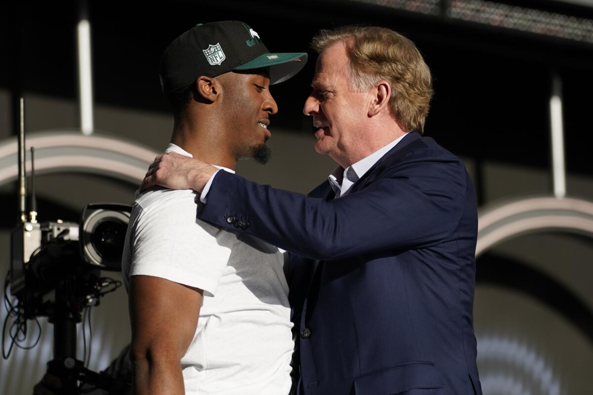 NFL Commissioner Roger Goodell, second from right, is joined by