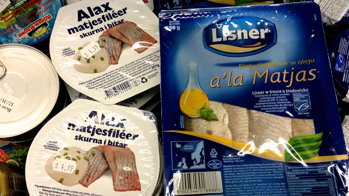 Cured fish, including matjes herring, in the refrigerator case at Alpine Village.