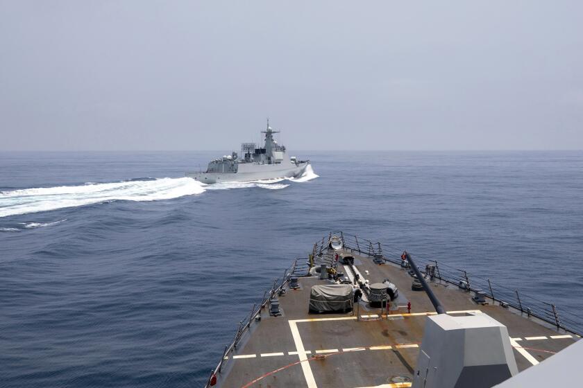 In this photo provided by the U.S. Navy, the USS Chung-Hoon observes a Chinese navy ship conduct what it called an "unsafe” Chinese maneuver in the Taiwan Strait, Saturday, June 3, 2023, in which the Chinese navy ship cut sharply across the path of the American destroyer, forcing the U.S. ship to slow to avoid a collision. The incident occurred as the American destroyer and Canadian frigate HMCS Montreal were conducting a so-called “freedom of navigation” transit of the strait between Taiwan and mainland China. (Mass Communication Specialist 1st Class Andre T. Richard/U.S. Navy via AP)