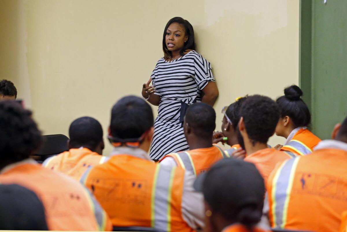 Lora King speaks to a group of young people who have had their own run-ins with police at a 2016 meeting of the Los Angeles Conservation Corps.