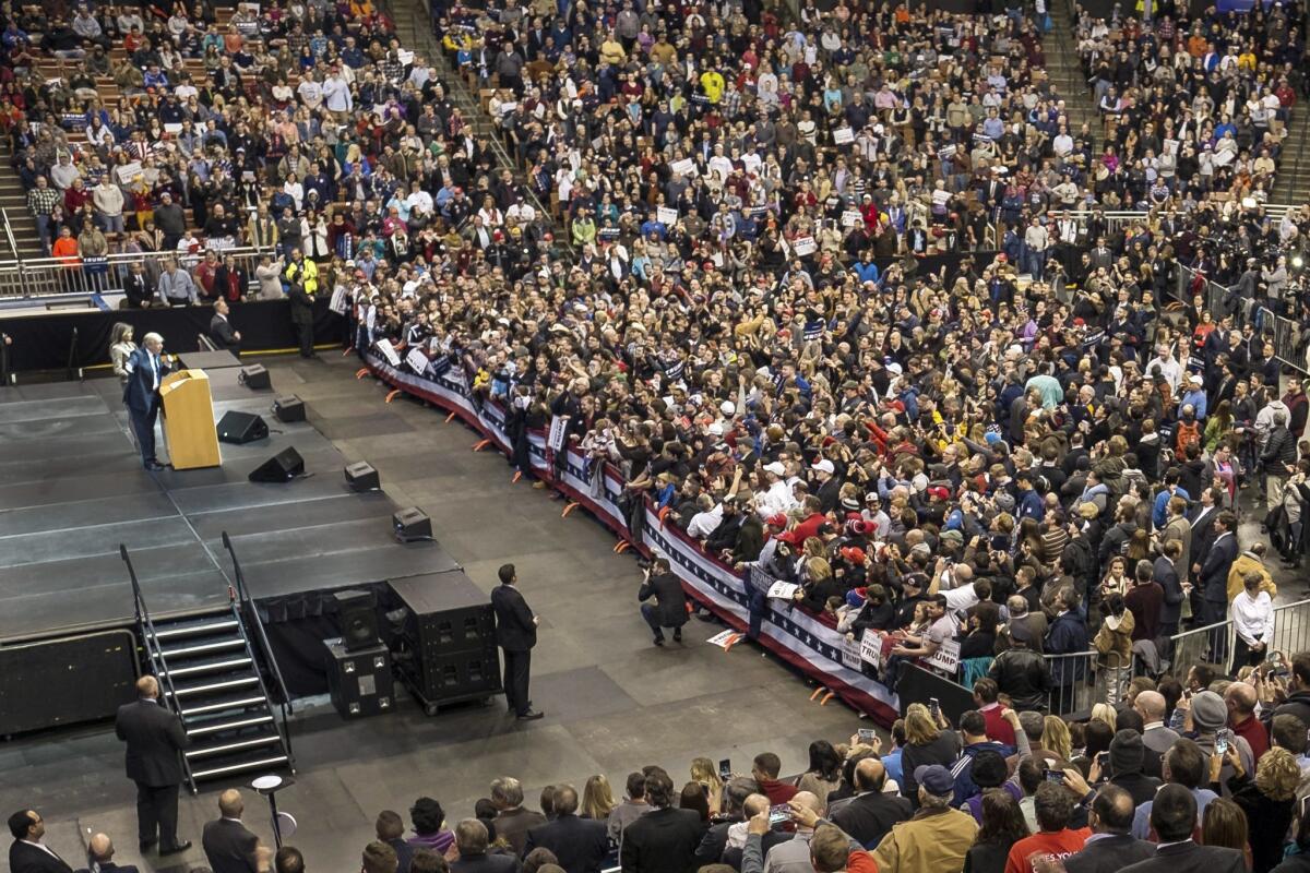 Donald Trump addresses a campaign rally in Manchester, N.H.