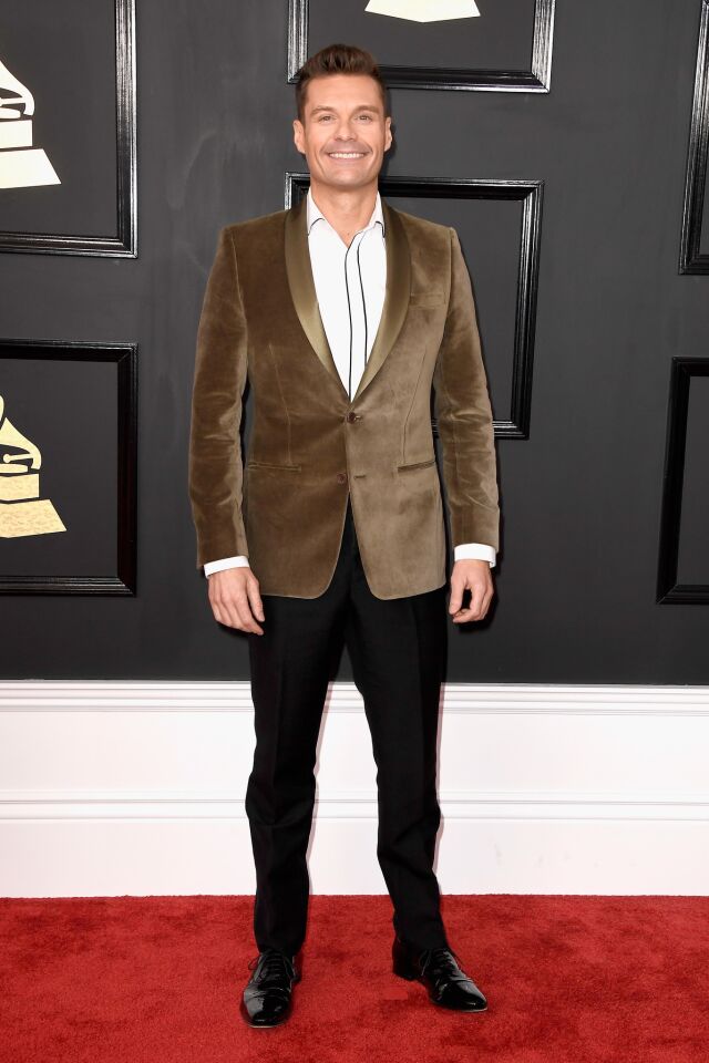 Ryan Seacrest arrives at the 59th Grammy Awards.