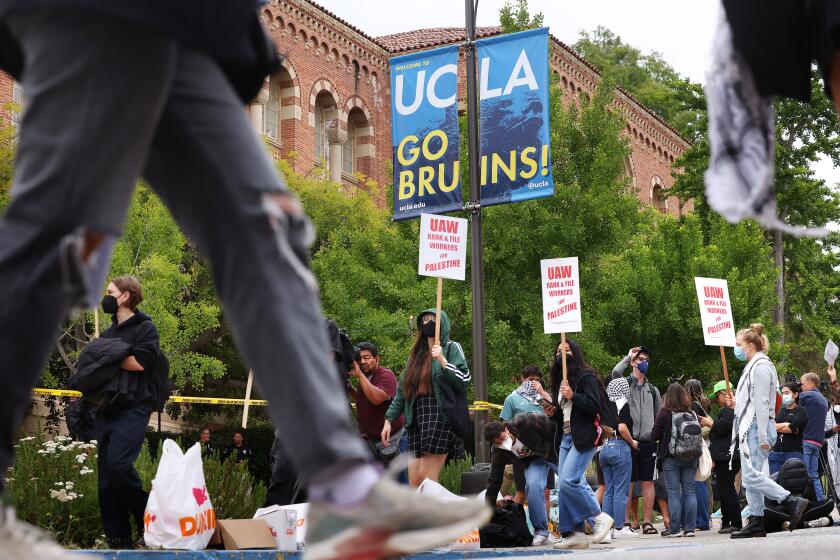 LOS ANGELES-CA-MAY 23, 2024: UCLA protestors gather on campus as a new pro-Palestinian encampment is built on campus on May 23, 2024. (Christina House / Los Angeles Times)