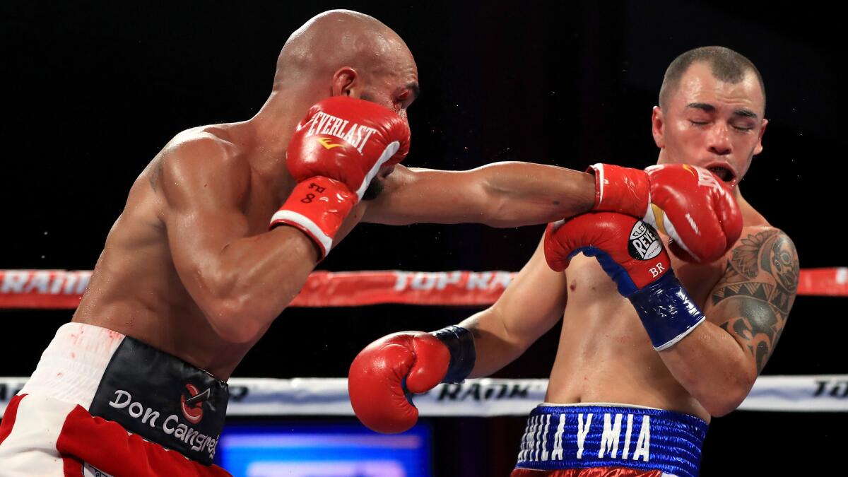 Ray Beltran connects with a left against Bryan Vasquez during their NABF/NABO lightweight title fight at the Microsoft Theater on Saturday