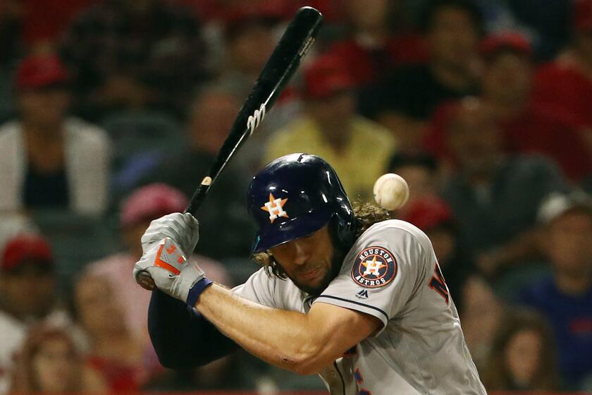 Houston Astros' Jake Marisnick is hit by a pitch during the sixth inning between the Angels and Astros.