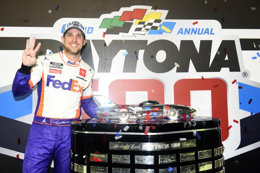 DAYTONA BEACH, FLORIDA - FEBRUARY 17: Denny Hamlin, driver of the #11 FedEx Express Toyota, poses with the trophy in Victory Lane after winning the NASCAR Cup Series 62nd Annual Daytona 500 at Daytona International Speedway on February 17, 2020 in Daytona Beach, Florida. (Photo by Jared C. Tilton/Getty Images)