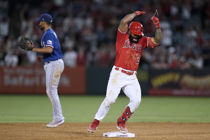Luis Rengifo celebrates his double with two runs for the Angels during the eighth inning on Saturday.