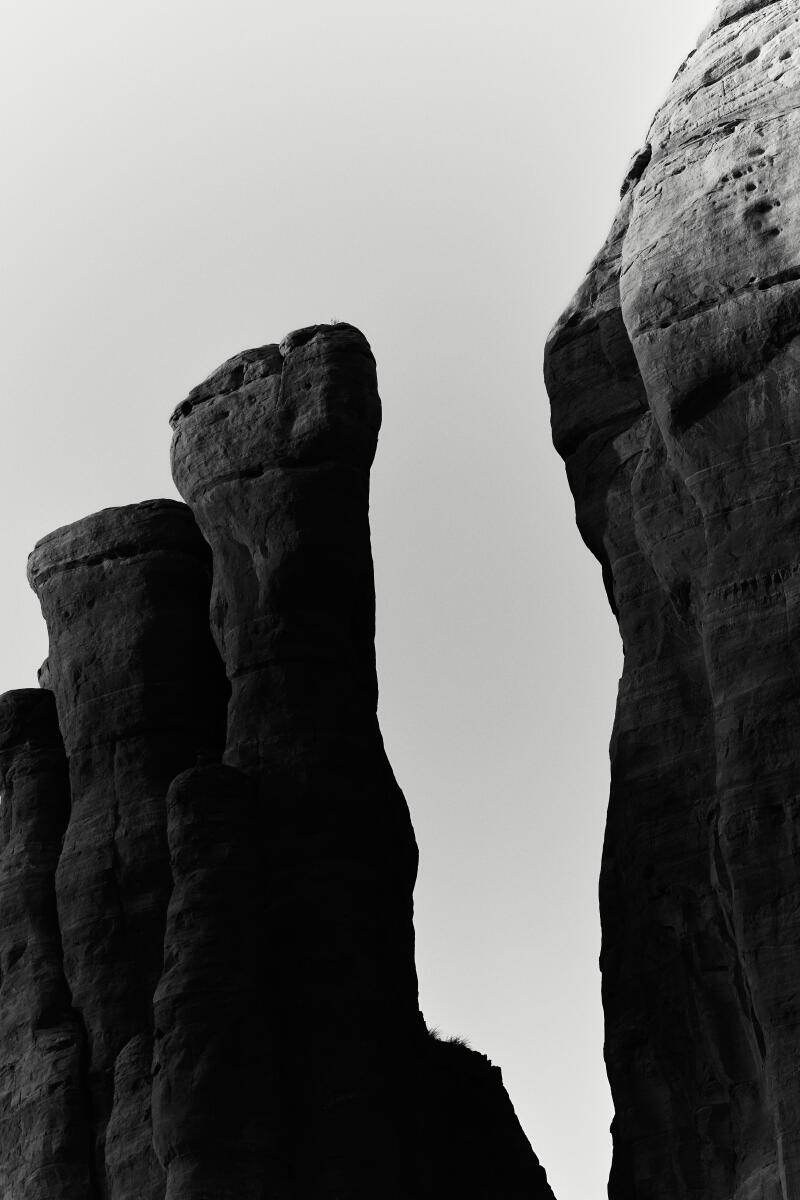 Two rock pillars in a black-and-white photo.