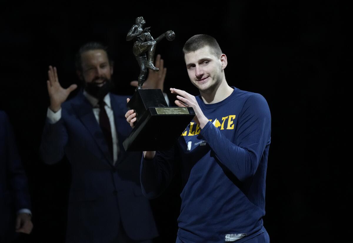Denver Nuggets center Nikola Jokic accepts the NBA MVP award on June 11, 2021, in Denver.