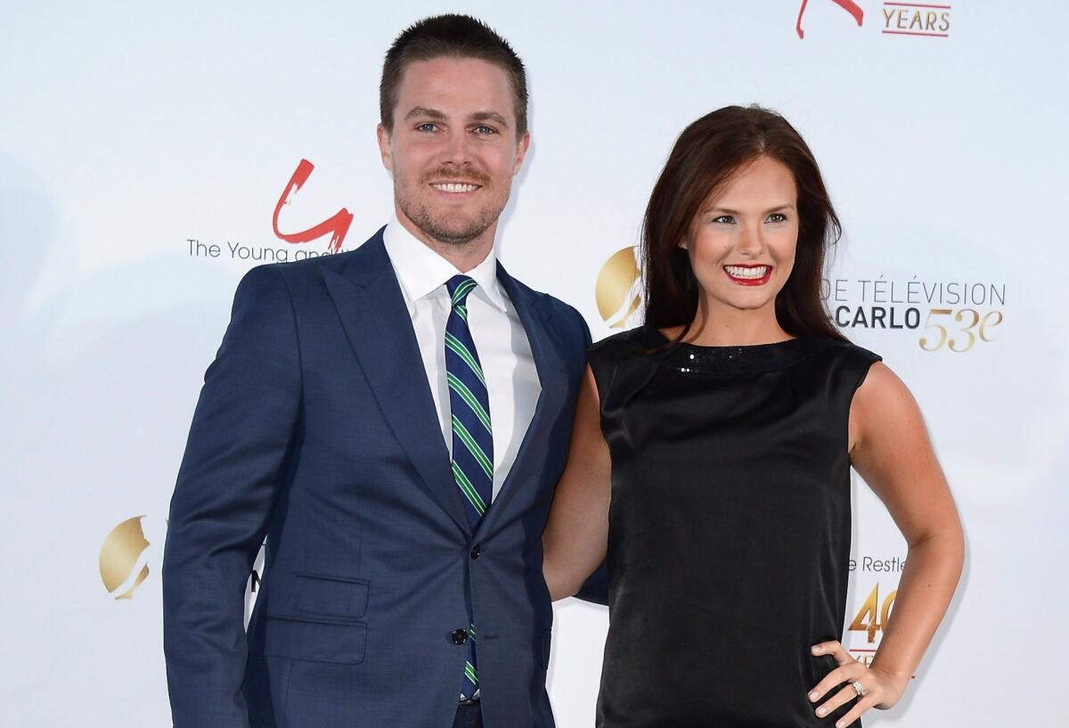 "Arrow" star Stephen Amell and his wife Cassandra Jean are expecting a baby together, their first.