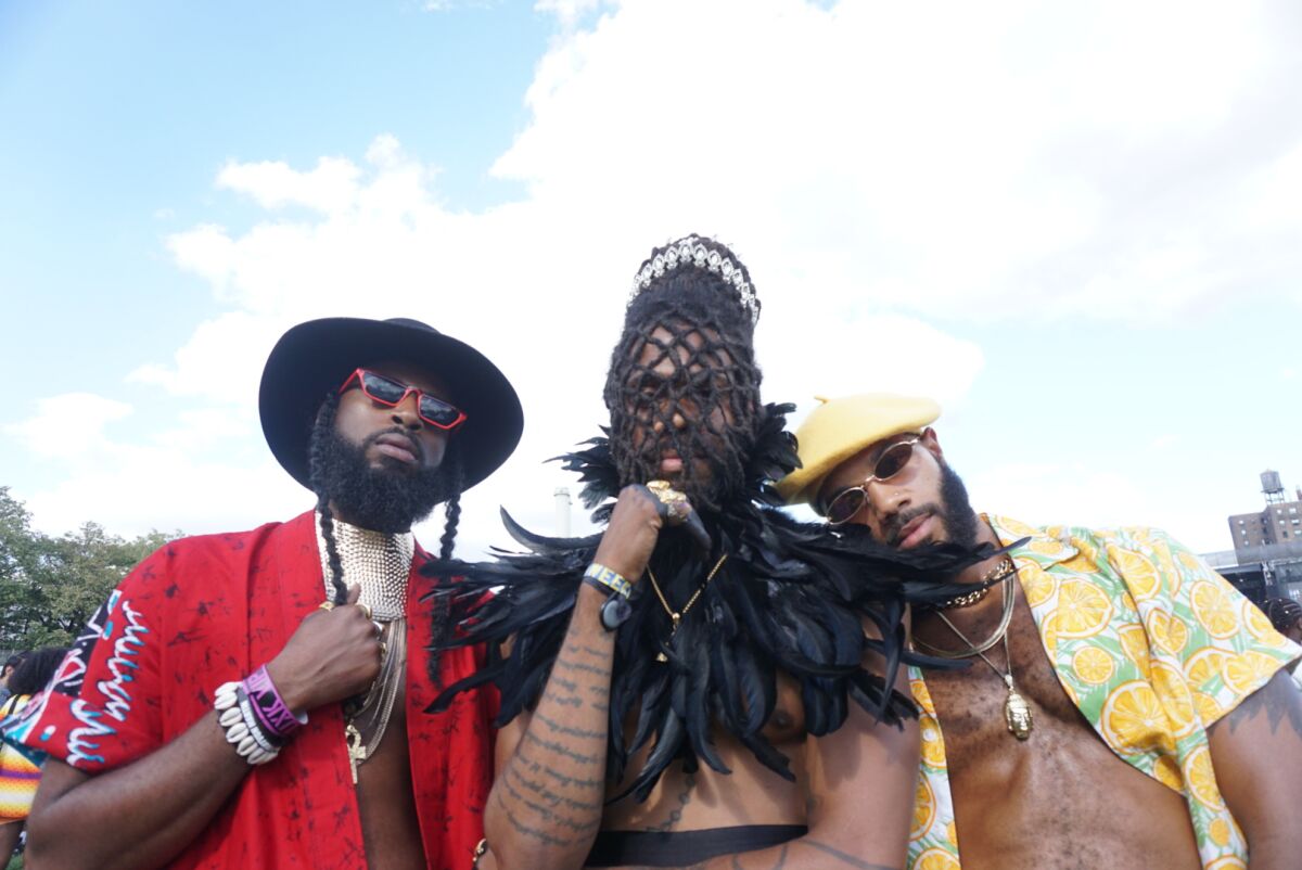 Friends Ivore Rousell, from left, Troy Landry and Walter Kemp pose for photo on Aug. 24, 2019, at Afropunk at Commodore Barry Park in Brooklyn, New York.
