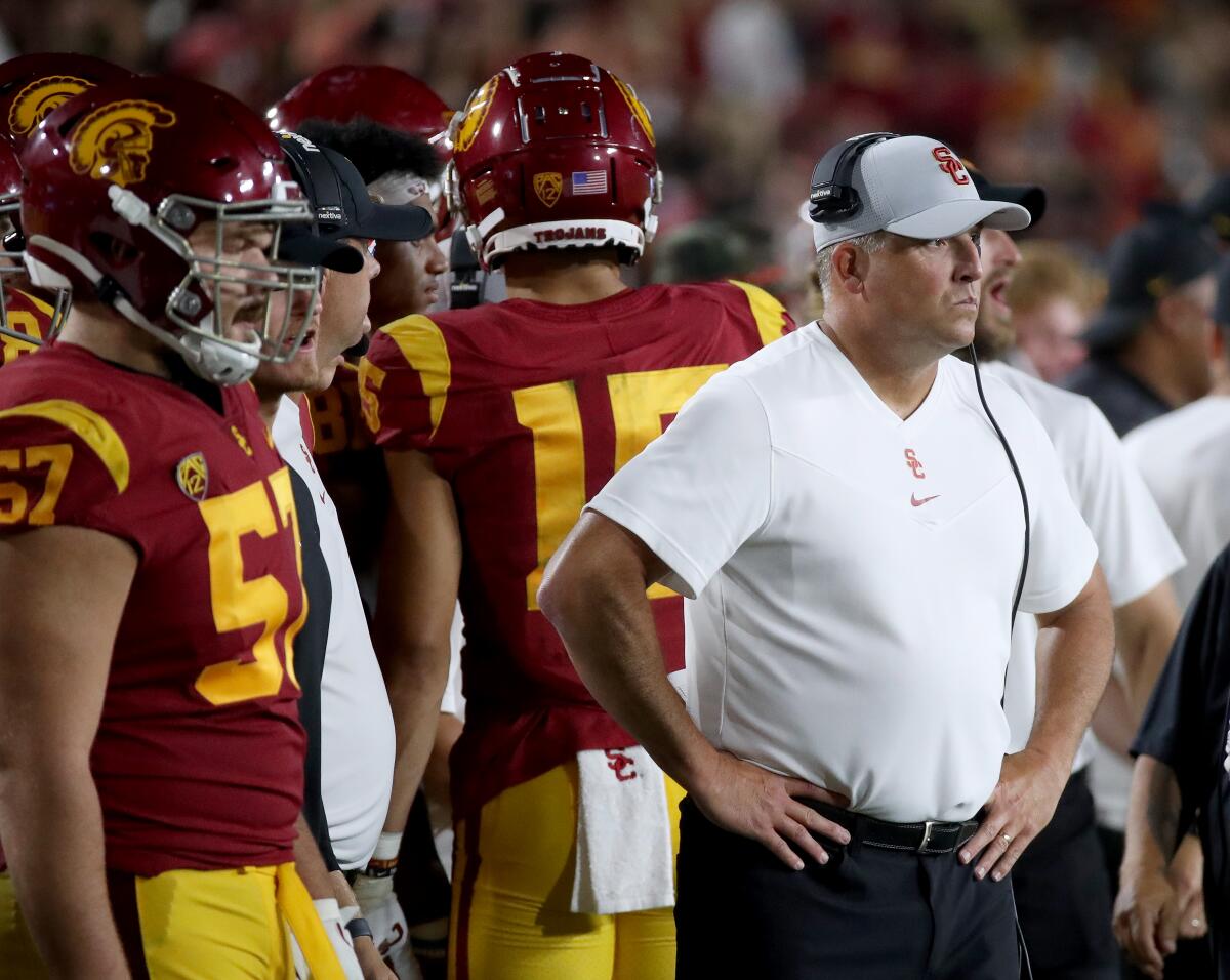 USC head coach Clay Helton watches from the sideline as his team loses to Stanford
