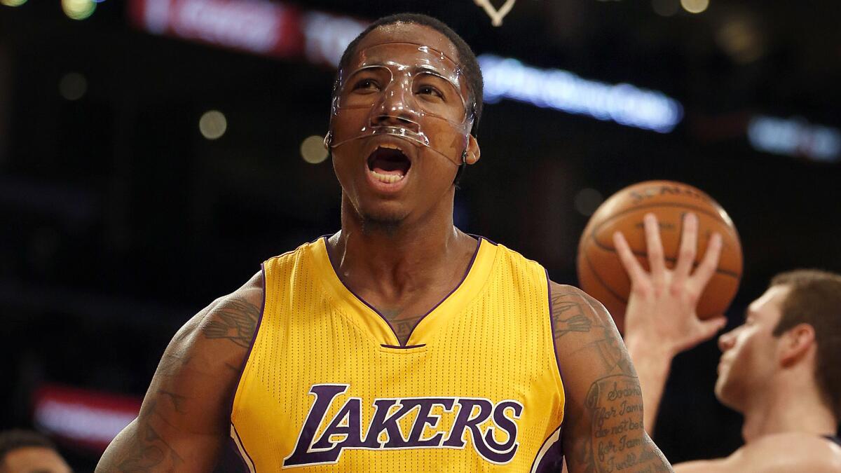 Lakers forward Ed Davis reacts after scoring a basket while being fouled during a loss to the Memphis Grizzlies at Staples Center on Friday.