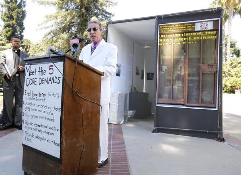 Speaking in front of a life-sized replica of a Secure Housing Unit cell, Assemblyman Tom Ammiano (D-San Francisco) speaks at a rally calling for the end of solitary confinement in California prisons at the Capitol in Sacramento.