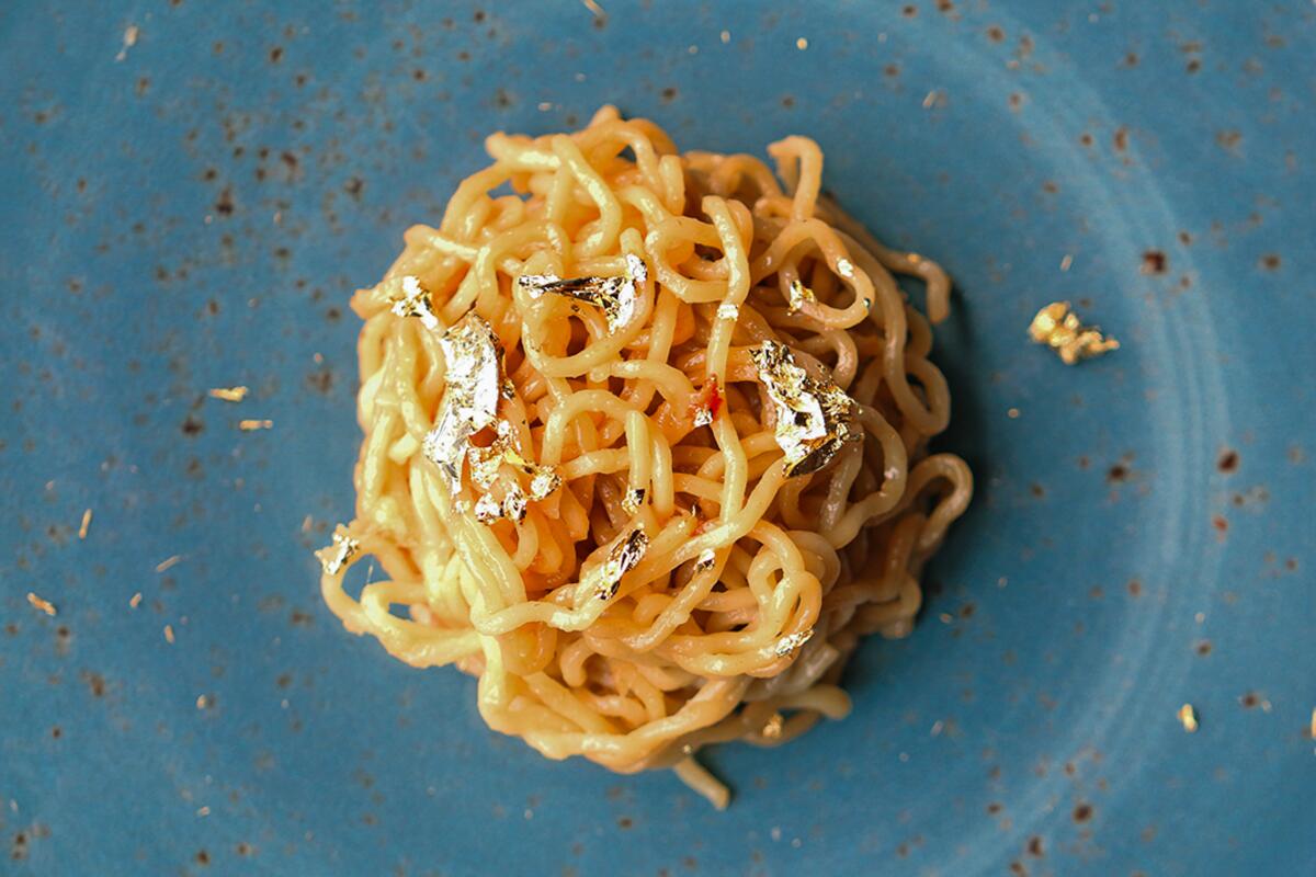 Garlic Noodles with edible gold from Crustacean