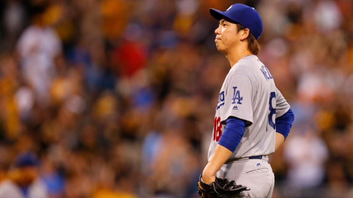 Dodgers pitcher Kenta Maeda reacts after giving up a three-run home run to Andrew McCutchen of the Pittsburgh Pirates during the sixth inning.