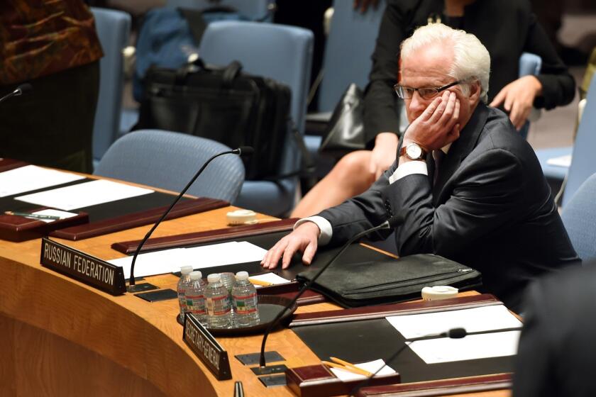 Russian Ambassador Vitaly Churkin listens before a meeting at the United Nations in New York. The Security Council met Monday to discuss the shooting down of Malaysia Airlines Flight 17 over Ukraine.