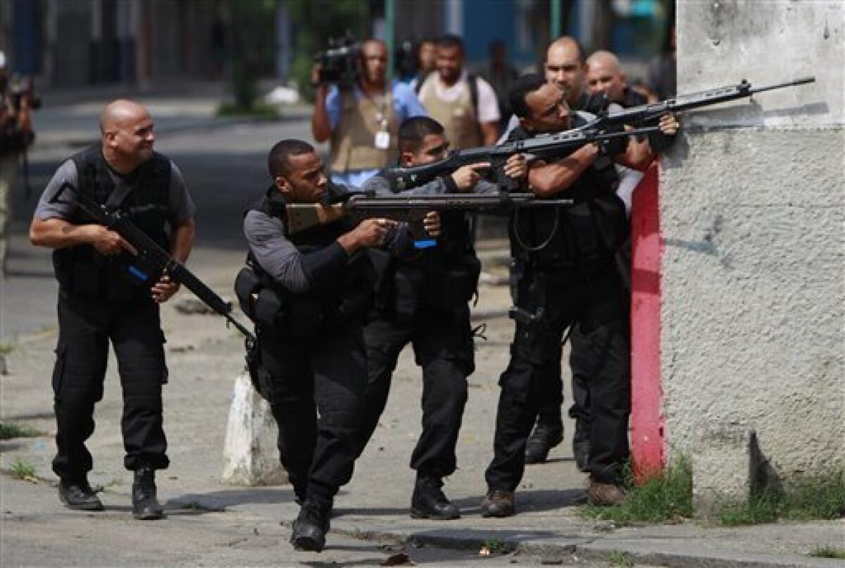 Rio cops use armor to raid slum where gang based - The San Diego