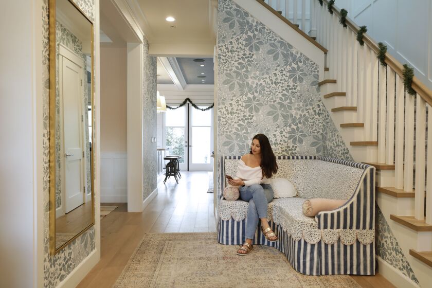 SANTA MONICA, CA -- DECEMBER 14, 2019: A sitting area near the front door at Victoria Aveyard’s house. The author of the popular young adult fantasy series, “Red Queen,” bought her Santa Monica “modern farmhouse” in 2017 and hired interior designer Christine Markatos to help her create her look. (Myung J. Chun / Los Angeles Times)