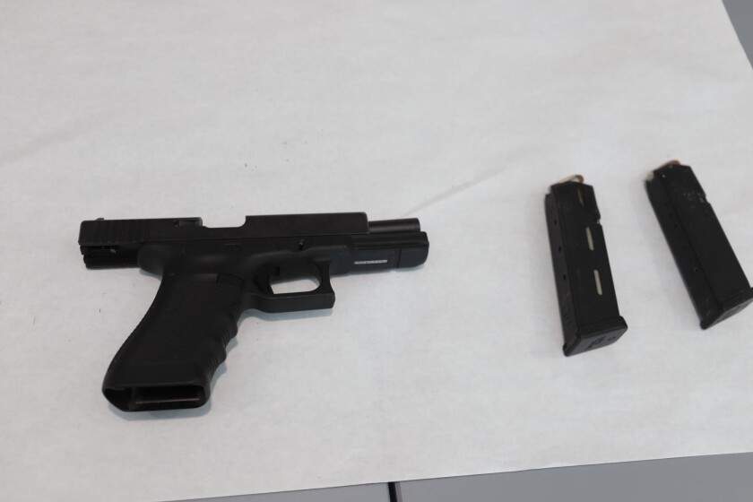 Sheriff's deputies seized three guns, including this pistol, during Friday morning's raid at an unlicensed Rainbow dispensary