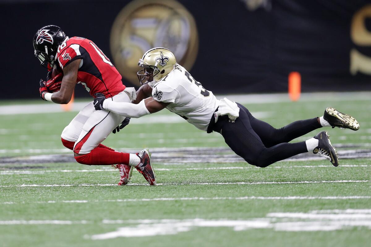 Atlanta's Taylor Gabriel is tackled by New Orleans' Jairus Byrd in Monday night's NFL game.
