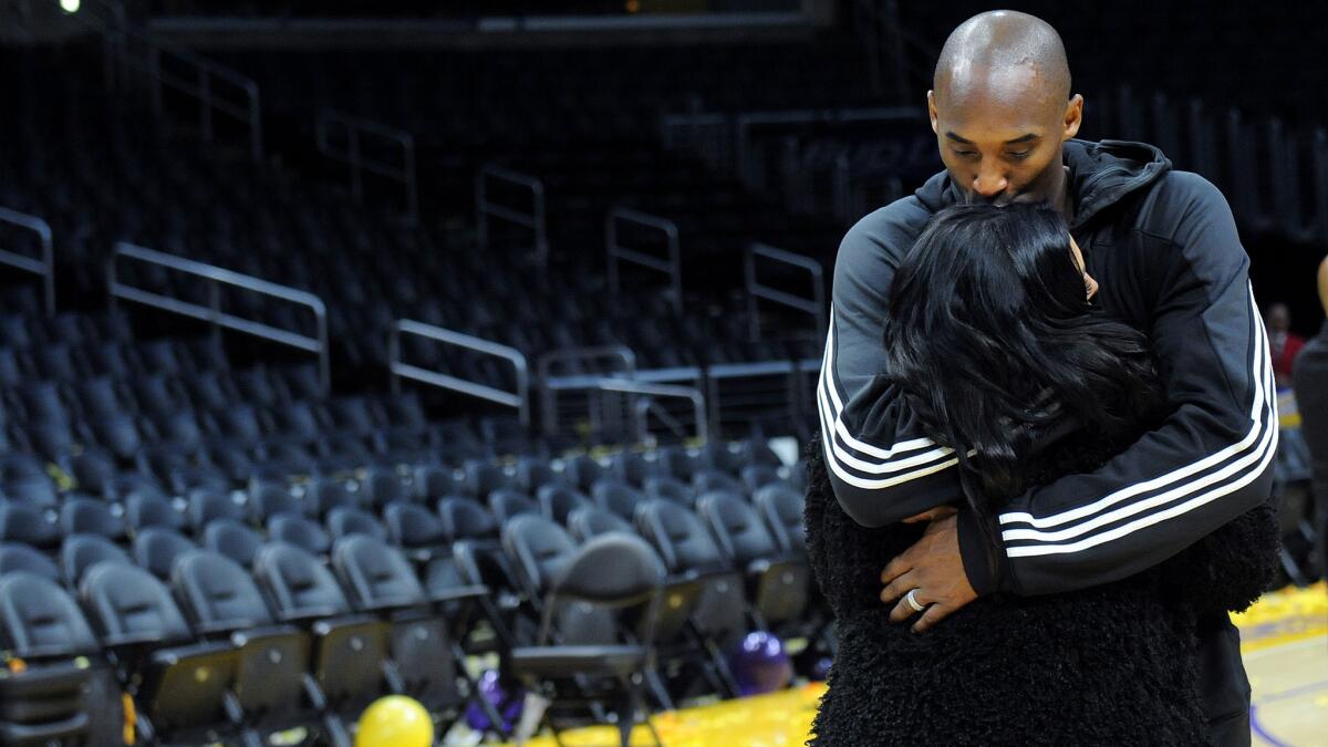 Kobe Bryant kisses his wife, Vanessa, after his last game at Staples Center on April 13, 2016.